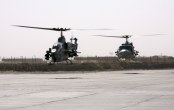 Image: AH-1W Super Cobra and a UH-1N Huey Helicopter